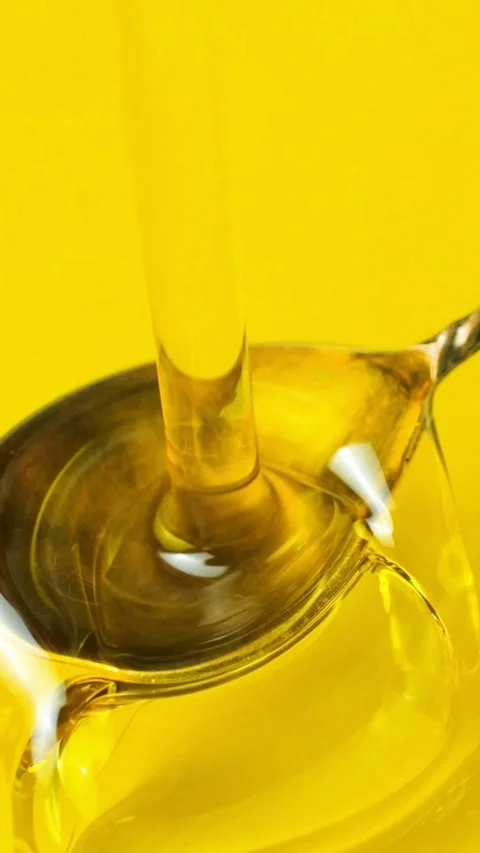 Natural Vegetable Oil Flow in Motion, Vertical Macro Slow Motion Stock Footage 327308527