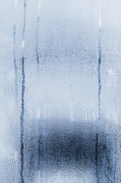 Natural vertical background with drops on glass Photos