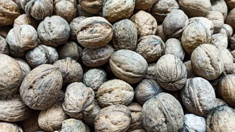 Natural Walnuts with shell background pattern texture Background of fresh walnut Stock Photos