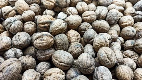 Natural Walnuts with shell background pattern texture Background of fresh walnut Stock Photos