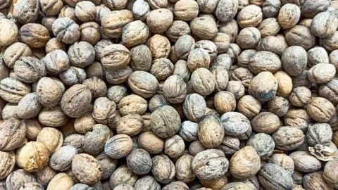 Natural Walnuts with shell background pattern texture Background of fresh walnut Stock Photos