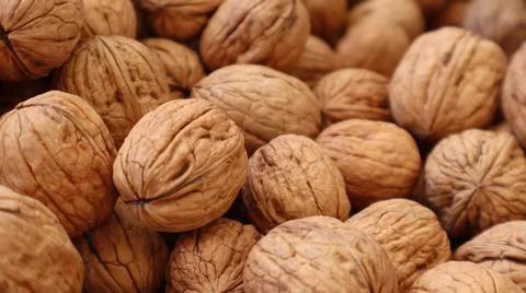 Natural Walnuts with shell background pattern texture.Background of fresh walnut Stock Photos