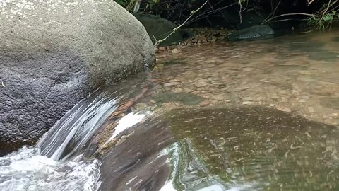 Natural Water Stream Flowing Between Rocks in Forest Stock Footage 330405616