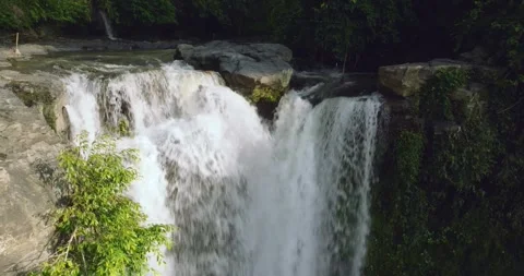 Natural waterfall in a forest setting. Slow motion. Zoom in Stock Footage 311591039