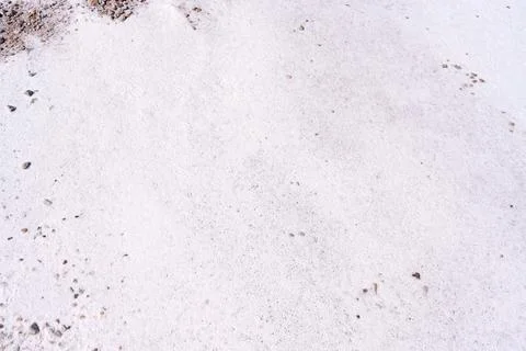 Natural White Salt Flat Surface Texture with Scattered Small Pebbles Stock Photos