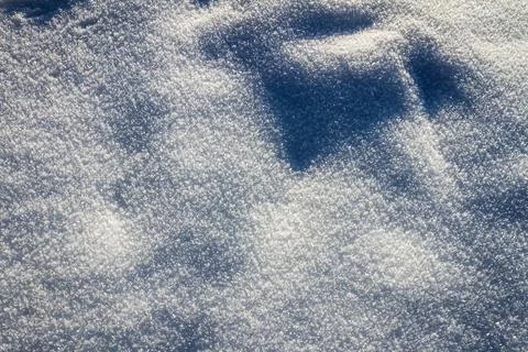 Natural winter backdrop featuring white snow texture Stock Photos