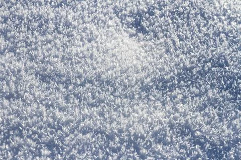 Natural winter backdrop featuring white snow texture Stock Photos