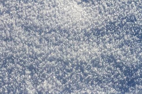 Natural winter backdrop featuring white snow texture Stock Photos