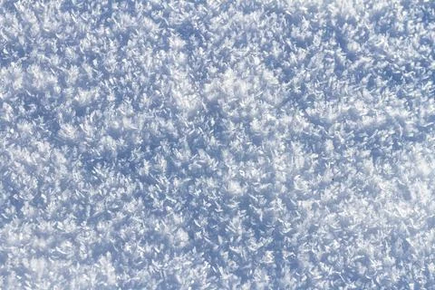 Natural winter backdrop featuring white snow texture Stock Photos