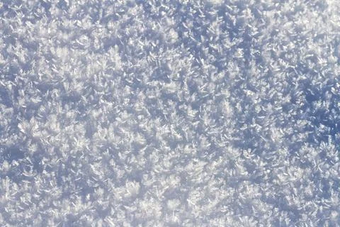 Natural winter backdrop featuring white snow texture Stock Photos