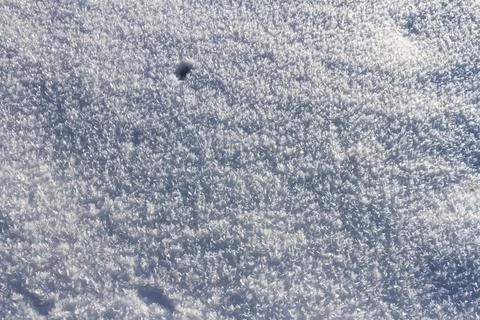 Natural winter backdrop featuring white snow texture Stock Photos