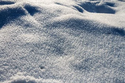Natural winter backdrop featuring white snow texture Stock Photos
