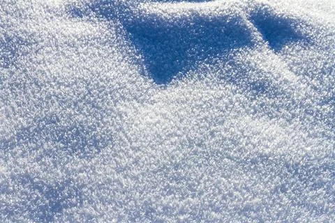 Natural winter backdrop featuring white snow texture Stock Photos