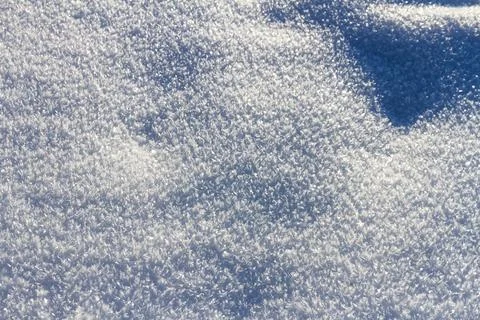 Natural winter backdrop featuring white snow texture Stock Photos