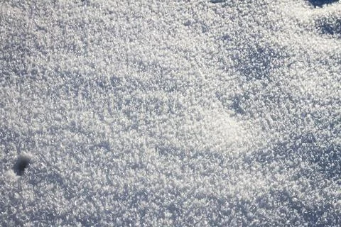 Natural winter backdrop featuring white snow texture Stock Photos