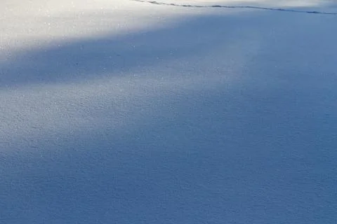 Natural winter backdrop featuring white snow texture Stock Photos