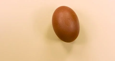 Naturally colored egg rotating Stock Footage 147214156