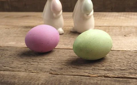 Naturally colored organic eggs on a rustic table with space for text, Easter Stockfoto's