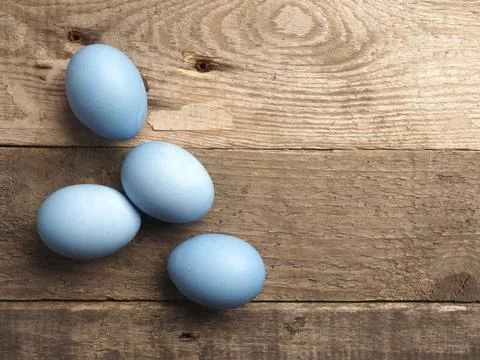 Naturally colored organic eggs on a rustic table with space for text, Easter 스톡 사진