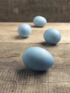 Naturally colored organic eggs on a rustic table with space for text, Easter 스톡 사진