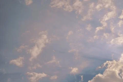 Nature background. Fluffy soft clouds in sky toned. Stockillustratie