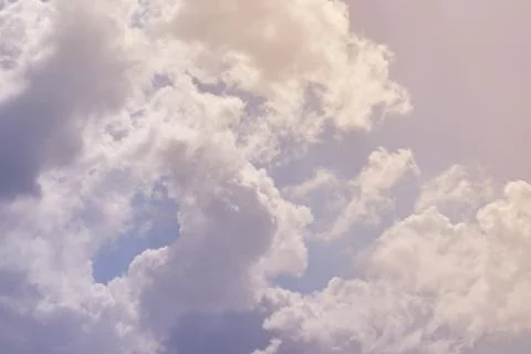 Nature background. Fluffy soft clouds in sky toned. Stock Illustration