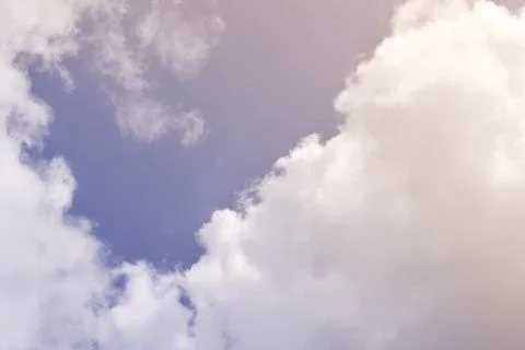 Nature background. Fluffy soft clouds in sky toned. Stock Illustration