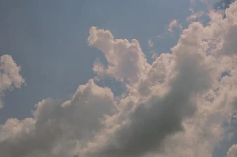 Nature background. Fluffy soft clouds in sky toned. Stock Illustration