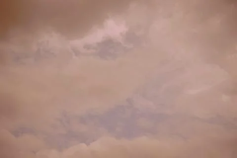 Nature background. Fluffy soft clouds in sky toned. Stockillustratie