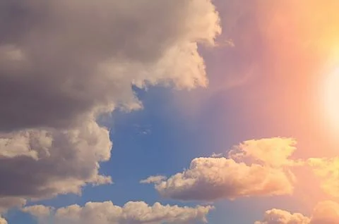 Nature background. Fluffy soft clouds in sky toned. Stockillustratie