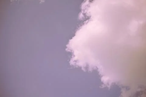 Nature background. Fluffy soft clouds in sky toned. Stockillustratie