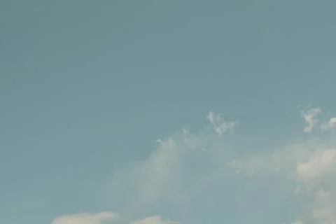 Nature background. Fluffy soft clouds in sky toned. Stockillustratie