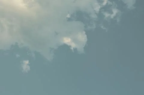 Nature background. Fluffy soft clouds in sky toned. Stockillustratie