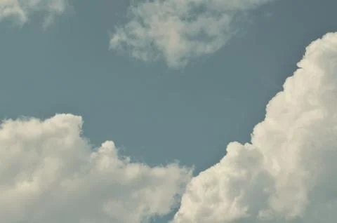 Nature background. Fluffy soft clouds in sky toned. Stock Illustration