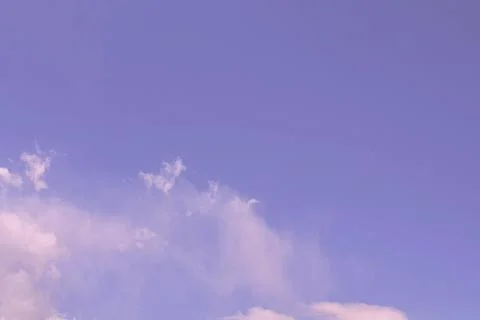 Nature background. Fluffy soft clouds in sky toned. Stockillustratie