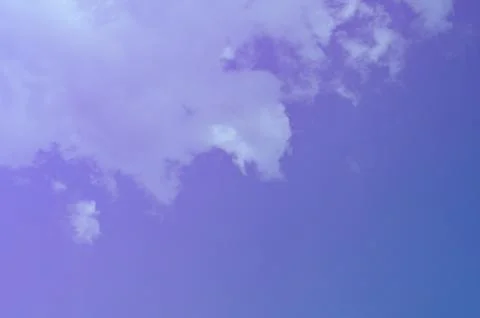 Nature background. Fluffy soft clouds in sky toned. Stockillustratie