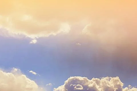 Nature background. Fluffy soft clouds in sky toned. Stock Illustration