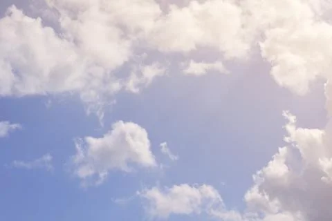 Nature background. Fluffy soft clouds in sky toned. Stock Illustration