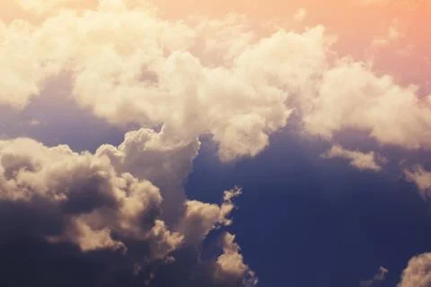 Nature background. Fluffy soft clouds in sky toned. Stock Illustration