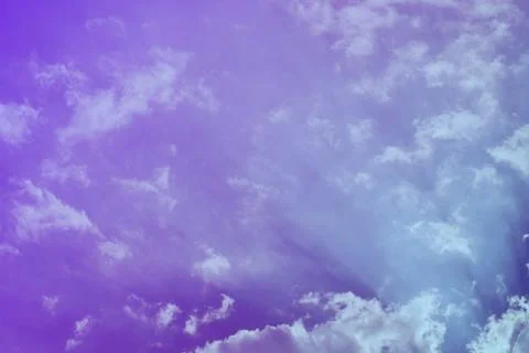 Nature background. Fluffy soft clouds in sky toned. Stockillustratie