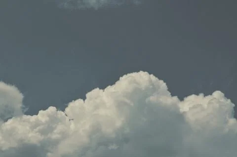 Nature background. Fluffy soft clouds in sky toned. Stockillustratie