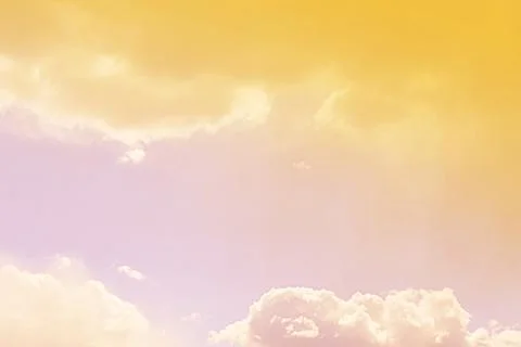 Nature background. Fluffy soft clouds in sky toned. Stock Photos
