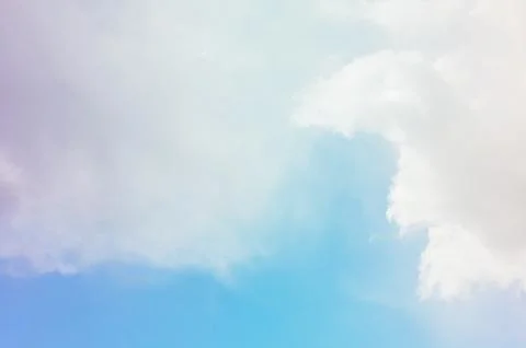 Nature background. Fluffy soft clouds in sky toned. Stock Photos