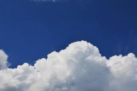 Nature background. Fluffy soft clouds in sky toned. Stock Photos