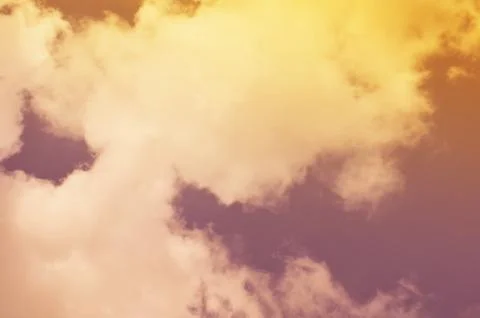 Nature background. Fluffy soft clouds in sky toned. Stock Photos