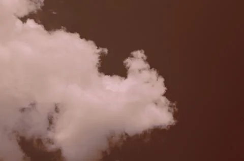 Nature background. Fluffy soft clouds in sky toned. Stock Photos