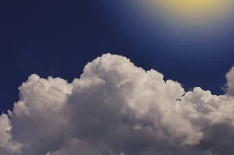Nature background. Fluffy soft clouds in sky toned. Stock Photos