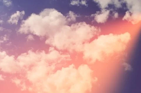 Nature background. Fluffy soft clouds in sky toned. Stock Photos