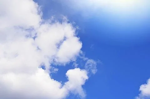Nature background. Fluffy soft clouds in sky toned. Stock Photos
