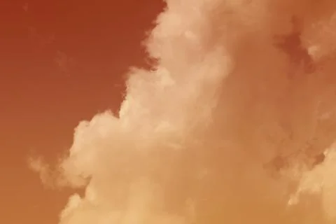 Nature background. Fluffy soft clouds in sky toned. Stock Photos